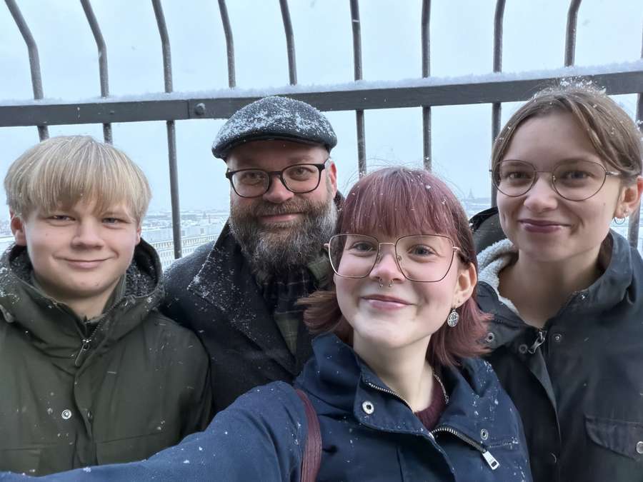 The four of us on a snowy balcony above Copenhagen